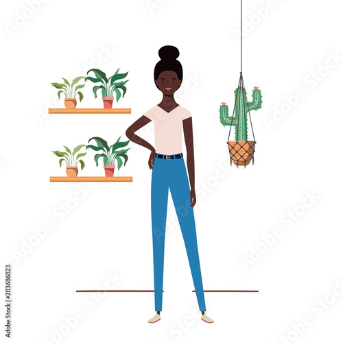 woman with houseplant and macrame hangers