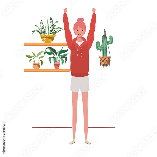 woman with houseplant and macrame hangers