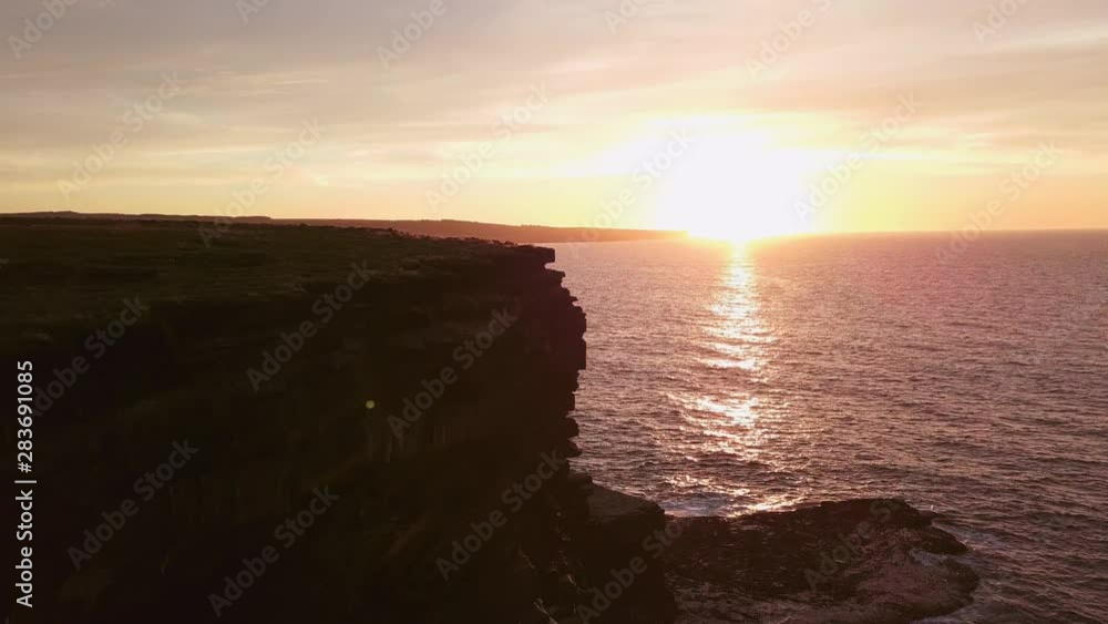 AERIAL DOLLY IN TILT DOWN Flying over Carrowmore Lacken cliff at sunset AERIAL DOLLY IN TILT DOWN Flying over Carrowmore Lacken cliff at sunset