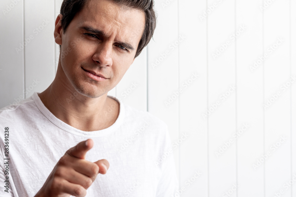 What about you? Young guy looking interested. Human emotions and facial expressions. Copy space on the right side What about you? Young guy looking interested. Human emotions and facial expressions. Copy space on the right side