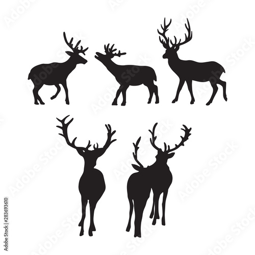 Isolated deers on the white background. Deers silhouettes. Vector EPS 10.