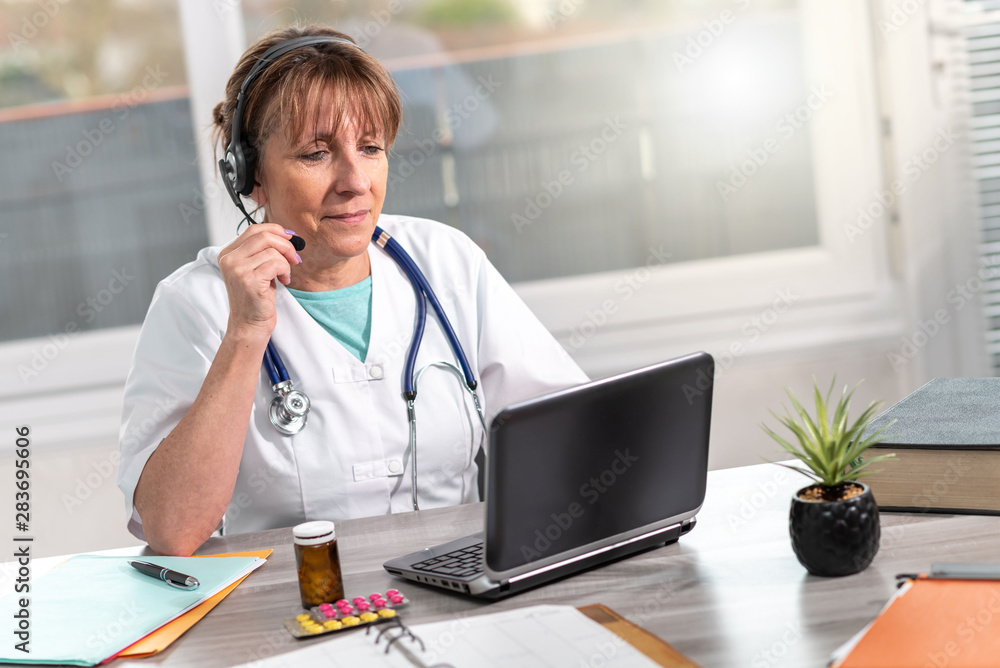 Portrait of female doctor during online medical consultation Portrait of female doctor during online medical consultation
