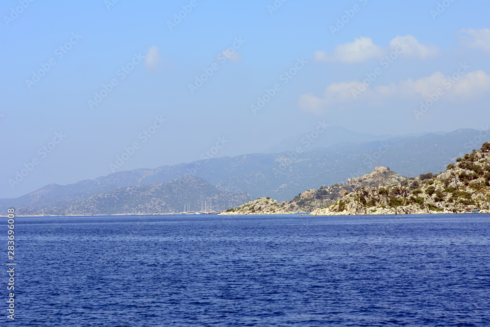 Rocky islands forested in the Mediterranean Sea. Concept - Tourism
