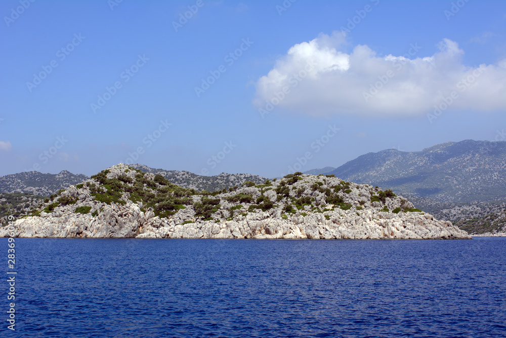 Rocky islands forested in the Mediterranean Sea. Concept - Tourism