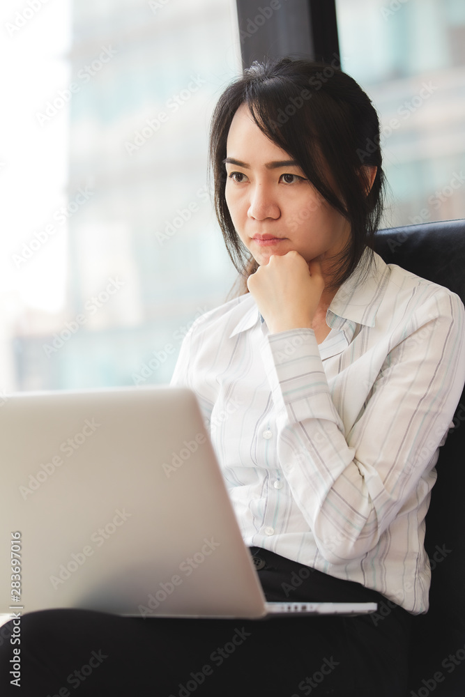 Beautiful business woman using a laptop computer. Beautiful business woman using a laptop computer.