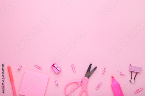 Pink school accessories on pink background. Back to school concept, minimalism