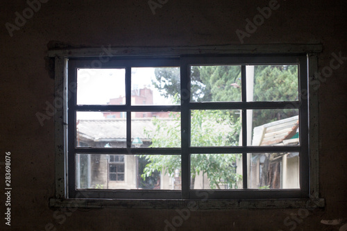 Dark room building with window case. Dark inside concrete wall windows