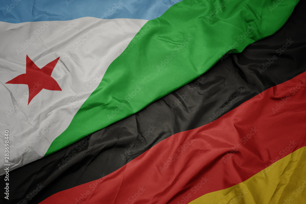 waving colorful flag of germany and national flag of djibouti.