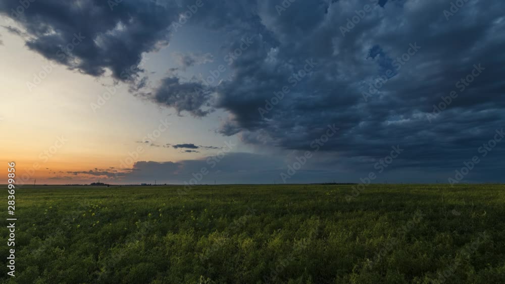 Storm clouds rolling over prairies at sunset 4K time lapse Storm clouds rolling over prairies at sunset 4K time lapse