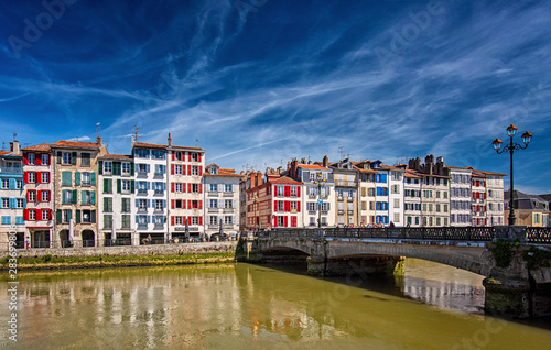 Colorful houses at the Nive river embankment in Bayonne, France