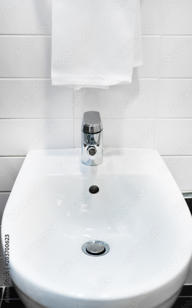 Fototapeta premium Bathroom interior. Bidet close-up view.