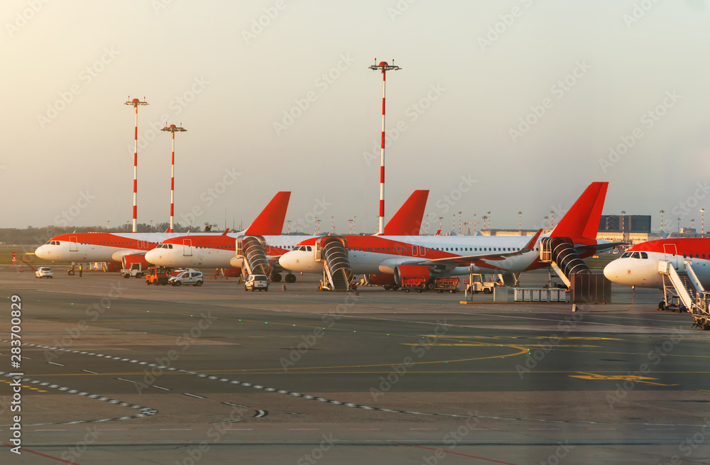 Fototapeta premium Many passenger planes in the airport.