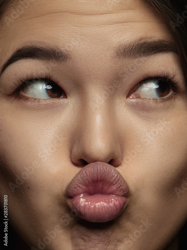 Vászonkép Close up portrait of young and emotional chinese woman