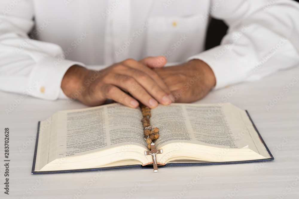 Male hands with The Bible. Men's studies Holy Scripture. Faith, spirtuality and religion background. Male hands with The Bible. Men's studies Holy Scripture. Faith, spirtuality and religion background.