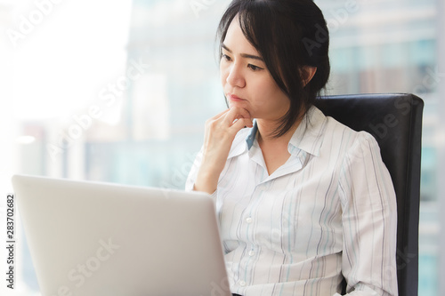 Beautiful business woman using a laptop computer.