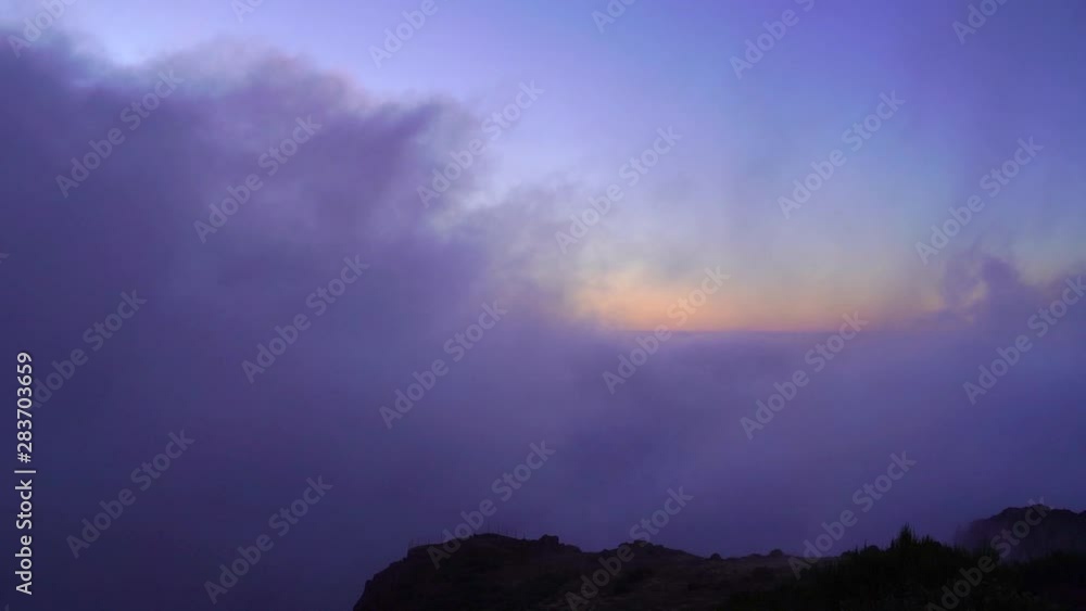 Full shot immerse in the clouds over mountaintop at sunsire. Amazing view on top of the mountains with misty, and foggy in the morning golden hour. Full shot immerse in the clouds over mountaintop at sunsire. Amazing view on top of the mountains with misty, and foggy in the morning golden hour.