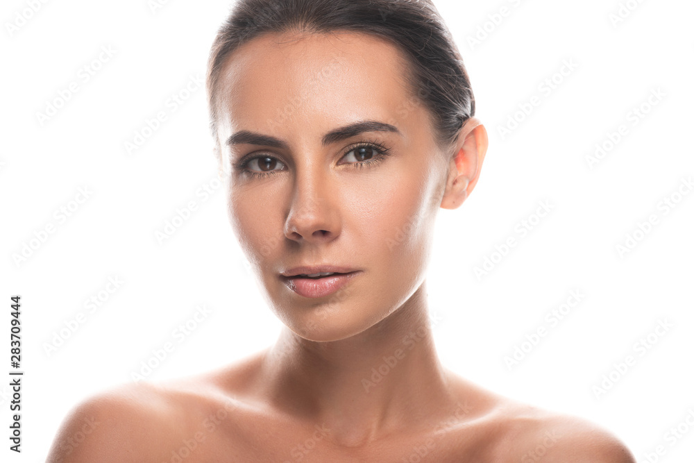 Fototapeta premium naked brunette young woman looking at camera isolated on white