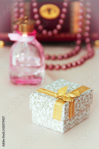 gift box with patterns and a yellow bow on a decorative background