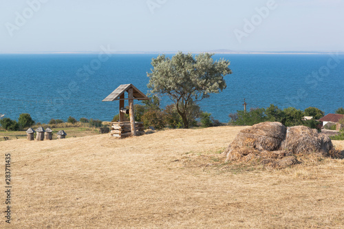  Landscape with a well in the ethnographic complex Ataman. Taman Temryuk district of the Krasnodar region photo