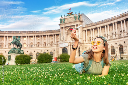 Photography Happy asian girl on a grass lawn playing with toy airplane, as symbol of travelling and transportation for tourists