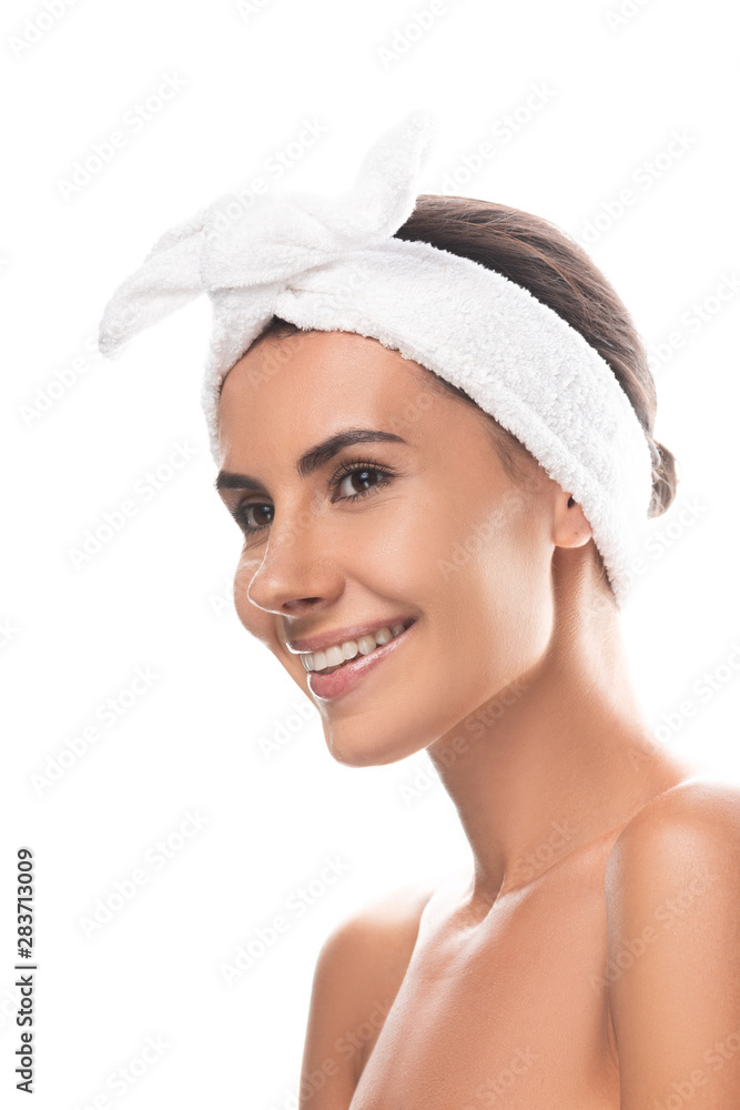 nude young woman in cosmetic hair band smiling isolated on white nude young woman in cosmetic hair band smiling isolated on white
