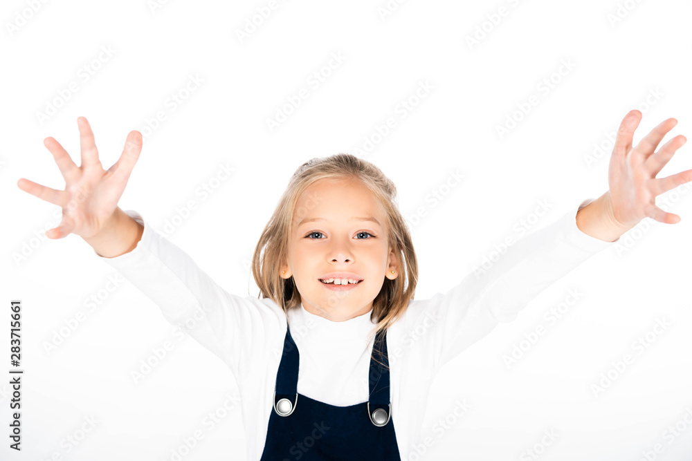 cheerful schoolgirl showing chalk stained hands while smiling at camera isolated on white cheerful schoolgirl showing chalk stained hands while smiling at camera isolated on white