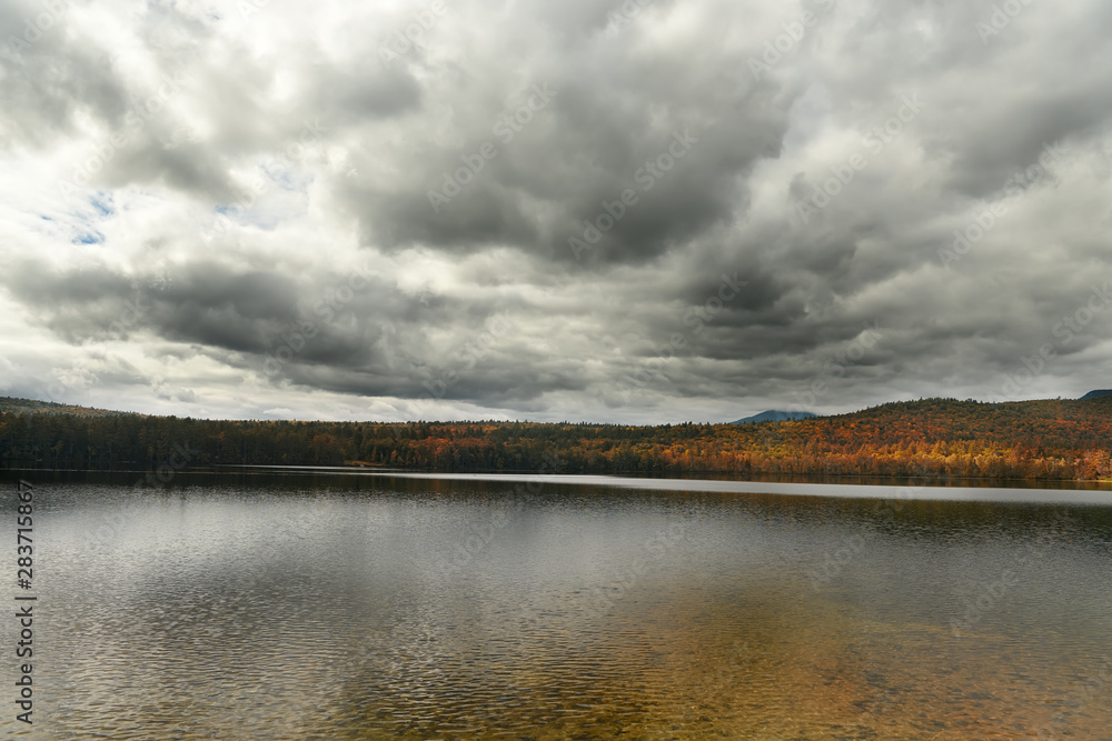 A lake among mountains covered with forests. autumn landscape . White Mountain National Park. USA. New Hamshire.