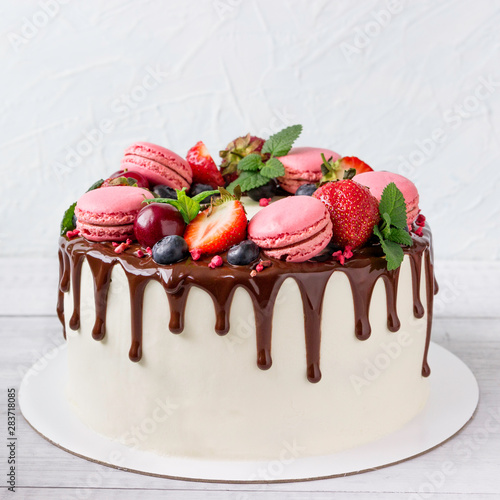 Birthday Drip Cake with chocolate ganache and fresh berries.