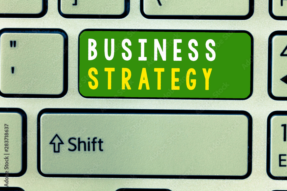 Handwriting text Business Strategy. Concept meaning Management game plan to achieve desired goal or objective. Handwriting text Business Strategy. Concept meaning Management game plan to achieve desired goal or objective.
