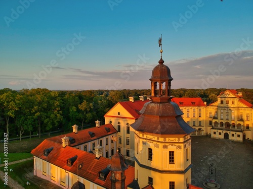 Aerial view of Nesvizh Castle in Minsk region of Belarus at sunset. 