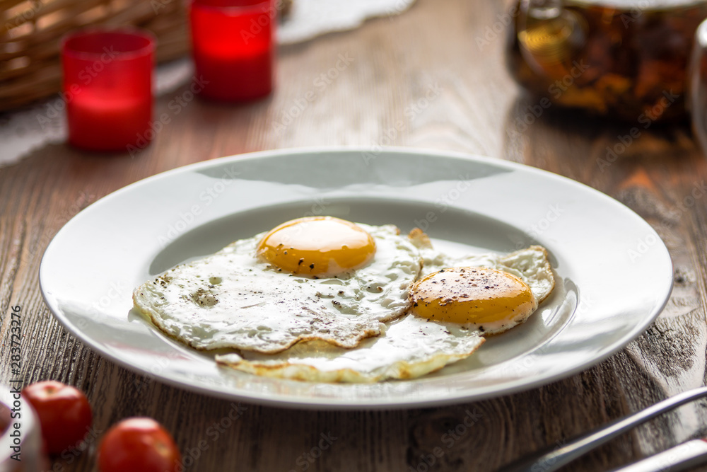 Classic fried eggs on a plate Classic fried eggs on a plate