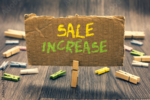 Writing note showing Sale Increase. Business photo showcasing Average Sales Volume has Grown Boost Income from Leads Clothespin holding paperboard important communicating message ideas