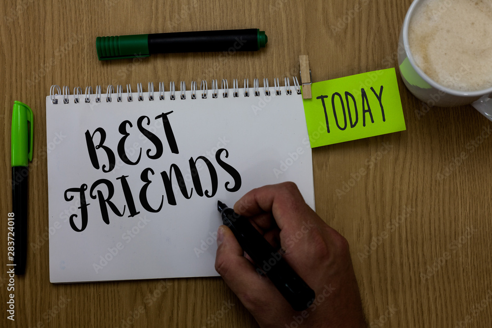 Writing note showing Best Friends. Business photo showcasing A person you value above other persons Forever buddies Man holding marker notebook clothepin reminder wooden table cup coffee Writing note showing Best Friends. Business photo showcasing A person you value above other persons Forever buddies Man holding marker notebook clothepin reminder wooden table cup coffee
