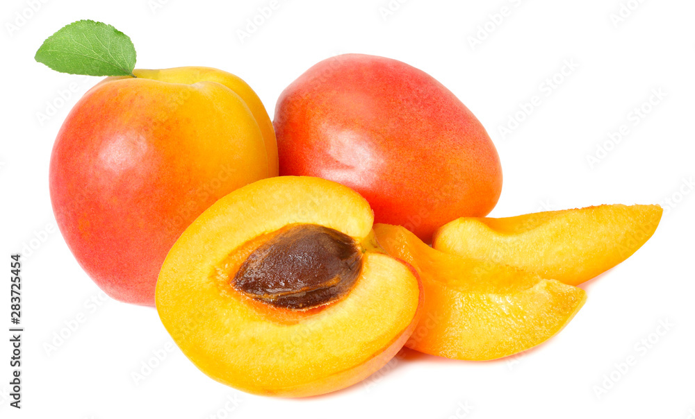 apricot fruits with slices and green leaf isolated on white background apricot fruits with slices and green leaf isolated on white background
