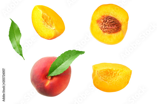peach fruit with green leaf and slices isolated on white background. top view