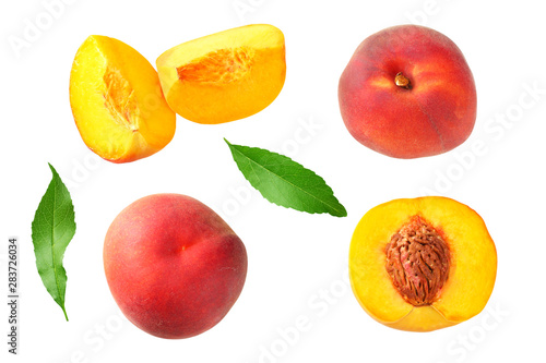 peach fruit with green leaf and slices isolated on white background. top view