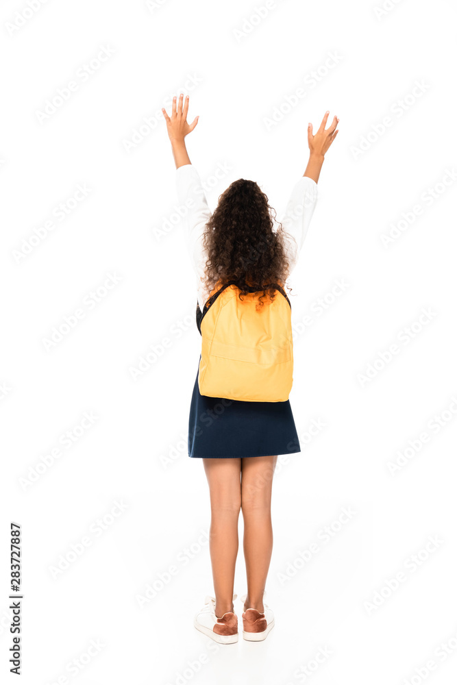 back view of african american schoolgirl gesturing with raised hands on white background back view of african american schoolgirl gesturing with raised hands on white background