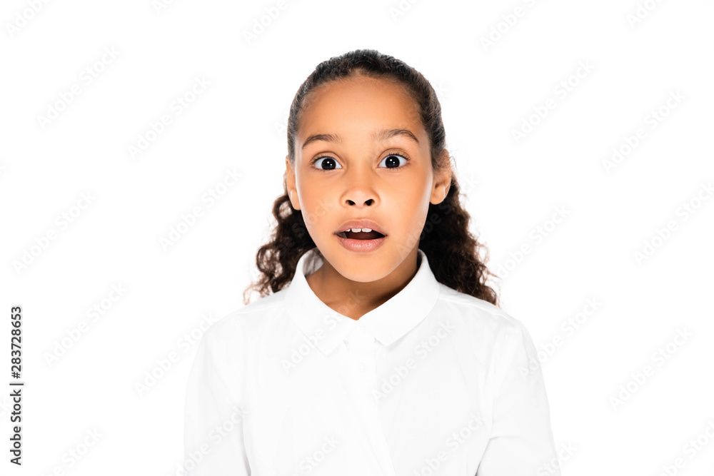 shocked african american schoolgirl looking at camera isolated on white shocked african american schoolgirl looking at camera isolated on white