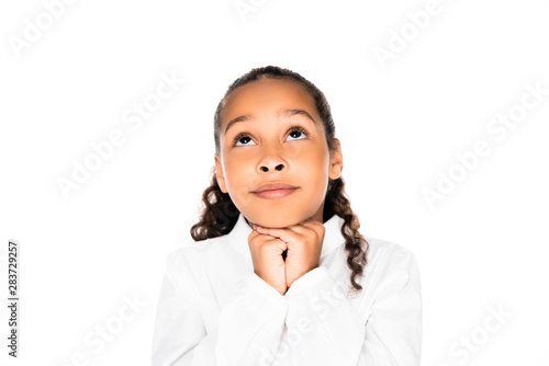 adorable african american schoolgirl looking up and showing please gesture isolated on white