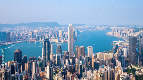 High view of Hong Kong skyline cityscape over Victoria harbour in the afternoon at Victoria Peak