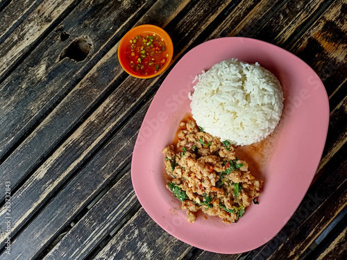 Rice topped with stir-fried pork and basil . Recommended food dishes in Thailand