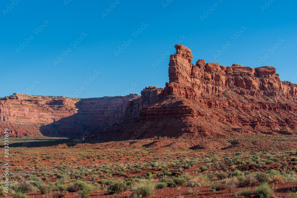 Landscape of large red buttes and monoliths at Valley of the Gods in Utah
