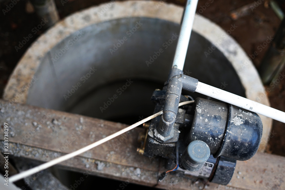 Installation of water pump on concrete well Installation of water pump on concrete well