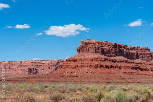 Landscape of large red buttes and monoliths at Valley of the Gods in Utah