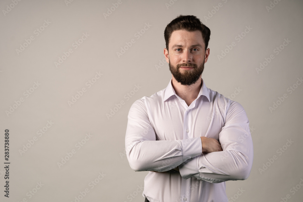 Man stands with his arms crossed . Concept - stability, confidence power, wealth. Man stands with his arms crossed . Concept - stability, confidence power, wealth.