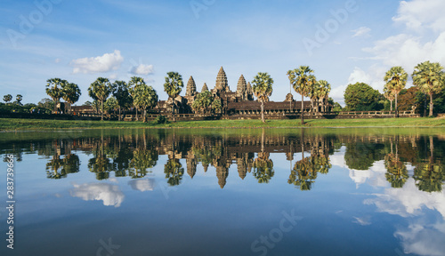 Angkor Wat temple panoramic reflection in lake water at sunset, Cambodia
