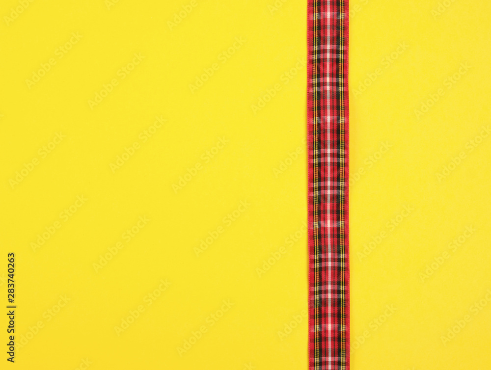 red ribbon in the box on a yellow background red ribbon in the box on a yellow background