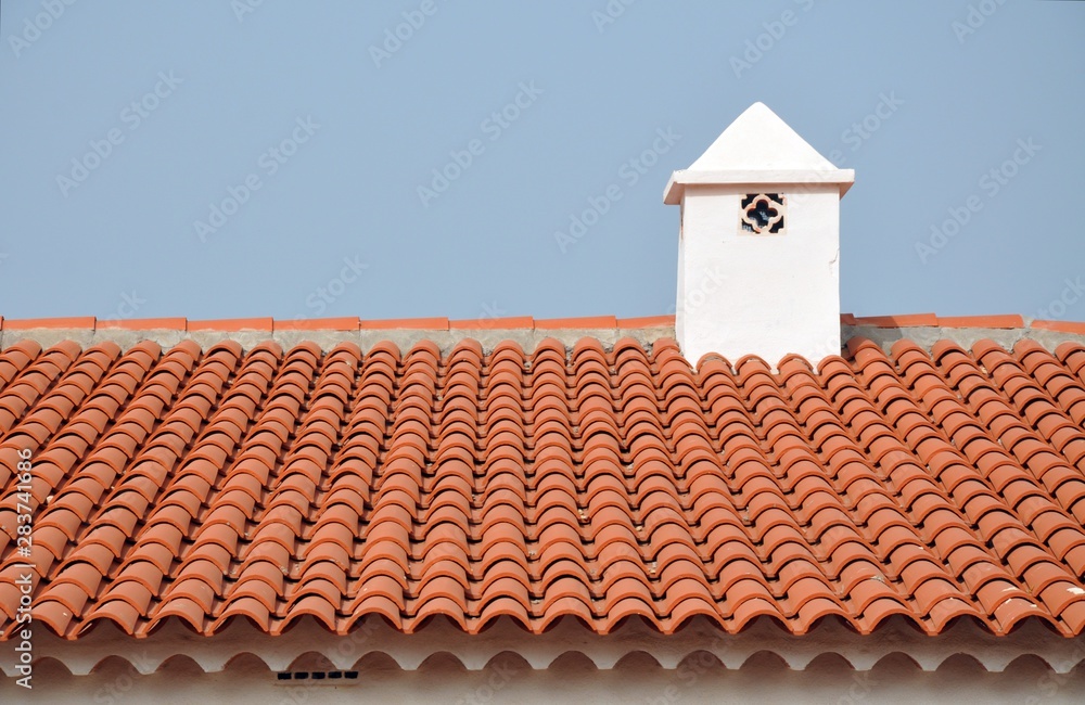 tile roof with ventilation pipe and blue sky tile roof with ventilation pipe and blue sky