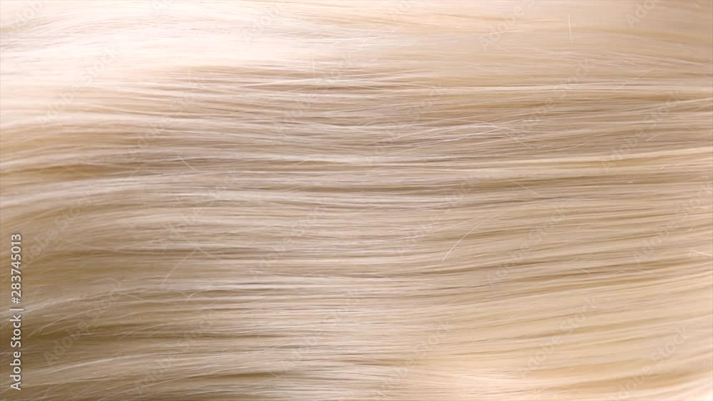Hair. Beautiful healthy long straight blonde hair closeup texture. Dyed wavy white blond hair background, coloring, extensions, cure, concept. Haircare. Slow motion 4K UHD video footage. 3840X2160 Hair. Beautiful healthy long straight blonde hair closeup texture. Dyed wavy white blond hair background, coloring, extensions, cure, concept. Haircare. Slow motion 4K UHD video footage. 3840X2160