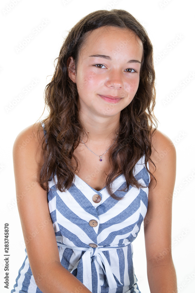 Happy teenage girl in strip fashion clothes standing isolated Happy teenage girl in strip fashion clothes standing isolated